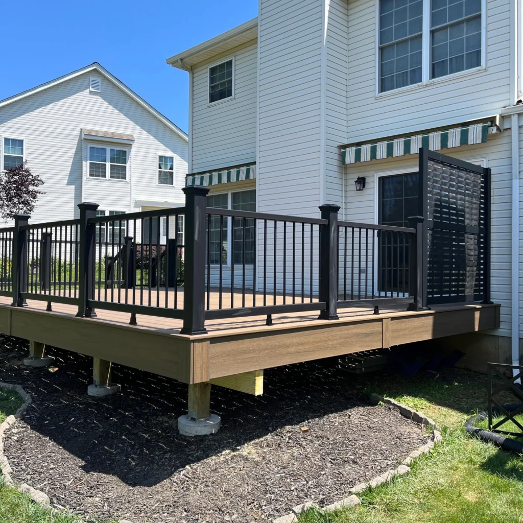 Deck with metal railings built by Clean Cut Deck Builders