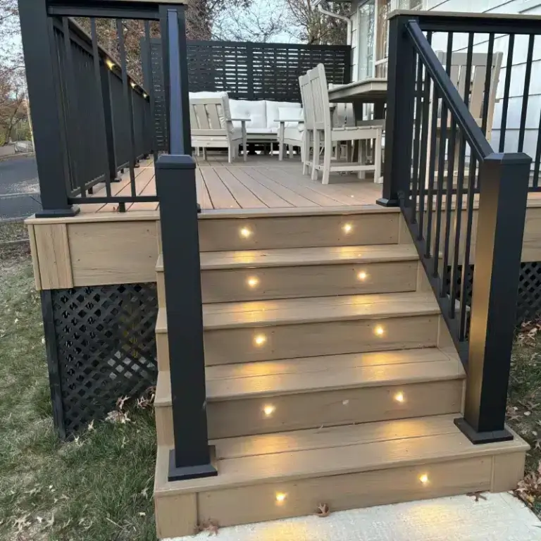 raised-residential-deck-with-lights-on-stairs-with-black-metal-railings-with-skirting-and-privacy-screen-featuring-outdoor-living-dining-set-area-in-southeast-pa