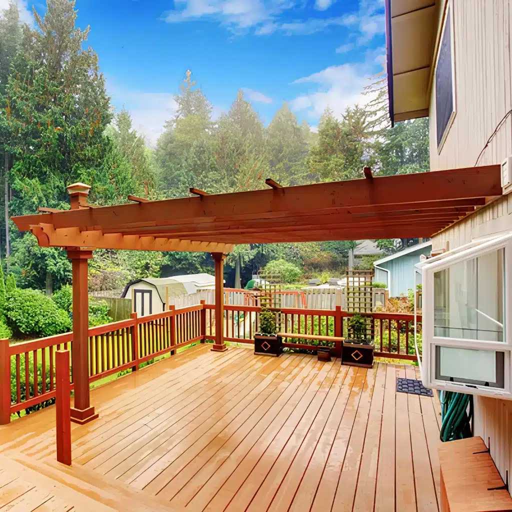 walkout-backyard-deck-with-attached-pergola-on-the-newly-cleaned-residential-deck-with-railings-featuring-overlooking-nature-view-in-south-east-pa